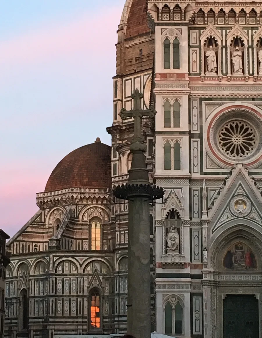 Florence Duomo at dusk with pink sky behind the dome.
